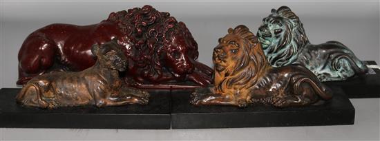 Four Lion figures on stands